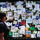 A woman passes by a memorial in Green-Wood Cemetery in Brooklyn, New York, on May 27, 2020.